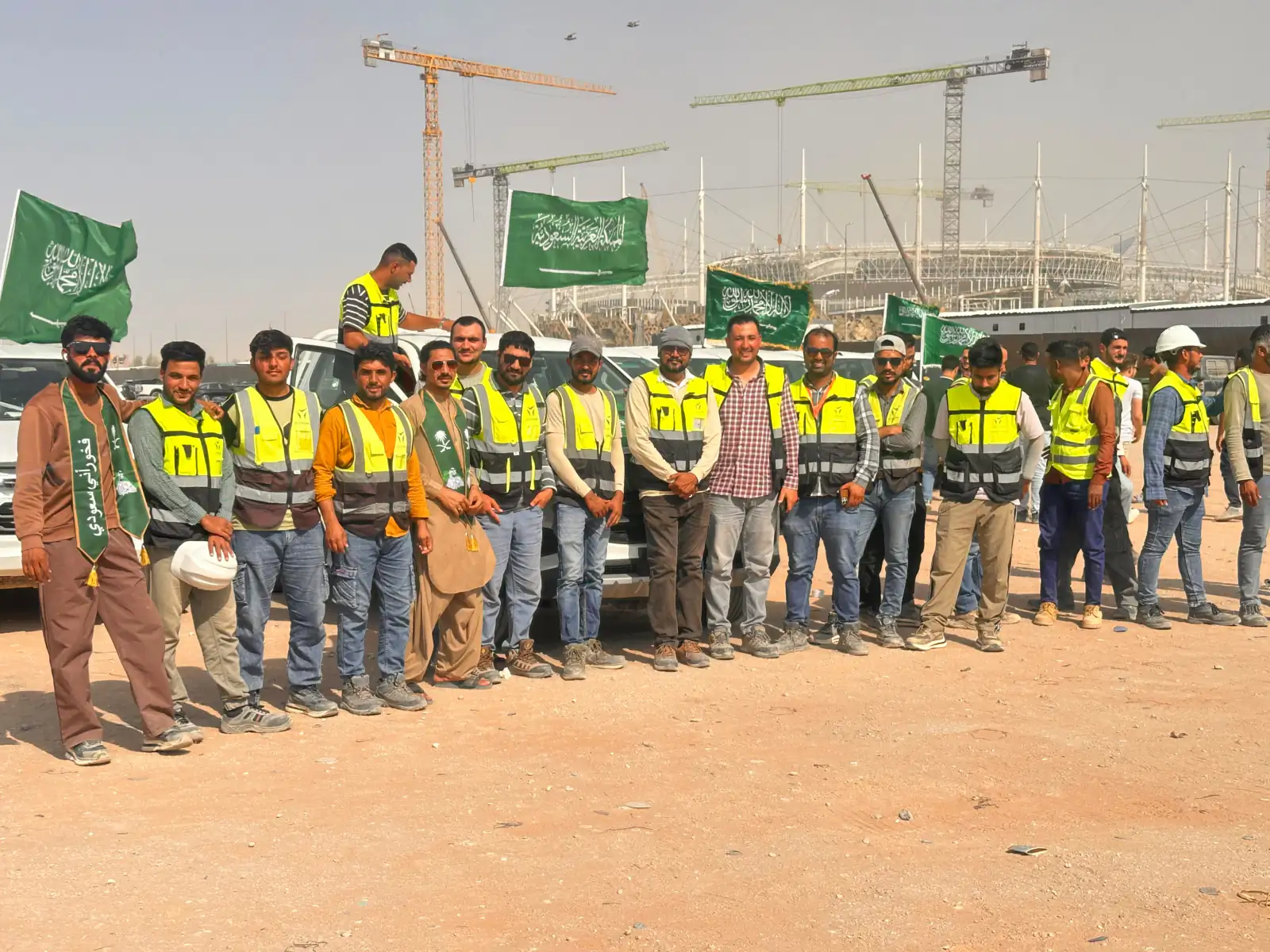 YAZ surveying teams lined up in front of the company vehicle fleet